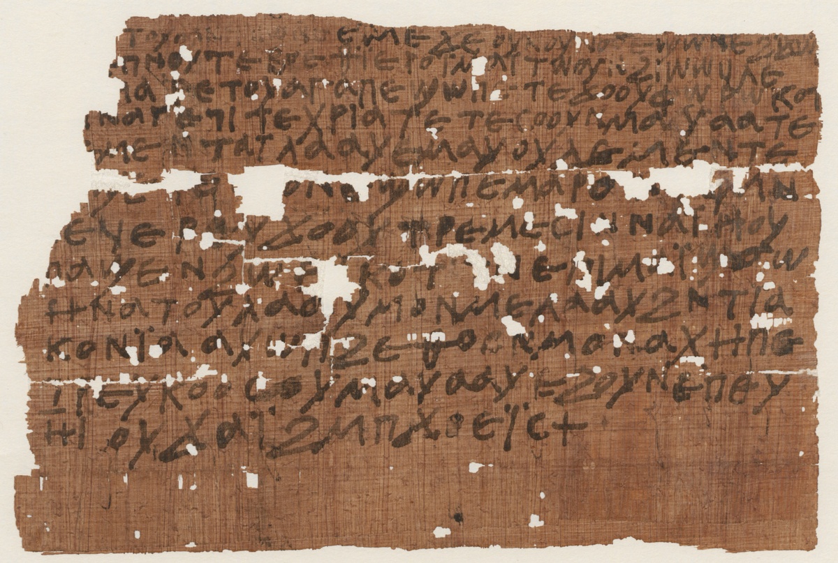 Alter, teilweise zerfallener Papyrus, auf dem Sätze in koptischer Sprache geschrieben sind. © ÖNB Bildarchiv
